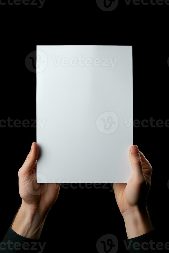 A human hand holding a blank sheet of white paper or card isolated on black background. ai generated photo