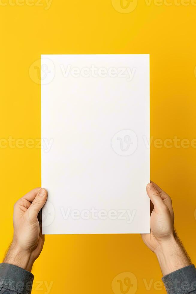 A human hand holding a blank sheet of white paper or card isolated on yellow background. ai generated photo