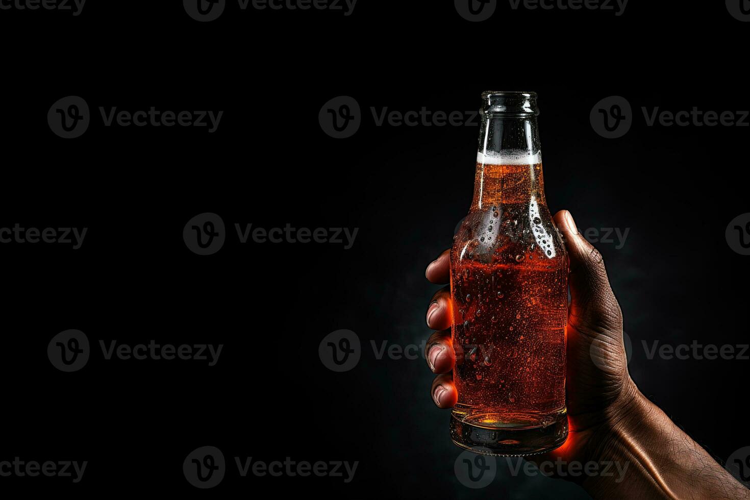 a male hand holding up a bottle of beer isolated on a black background with copy space. ai generated photo