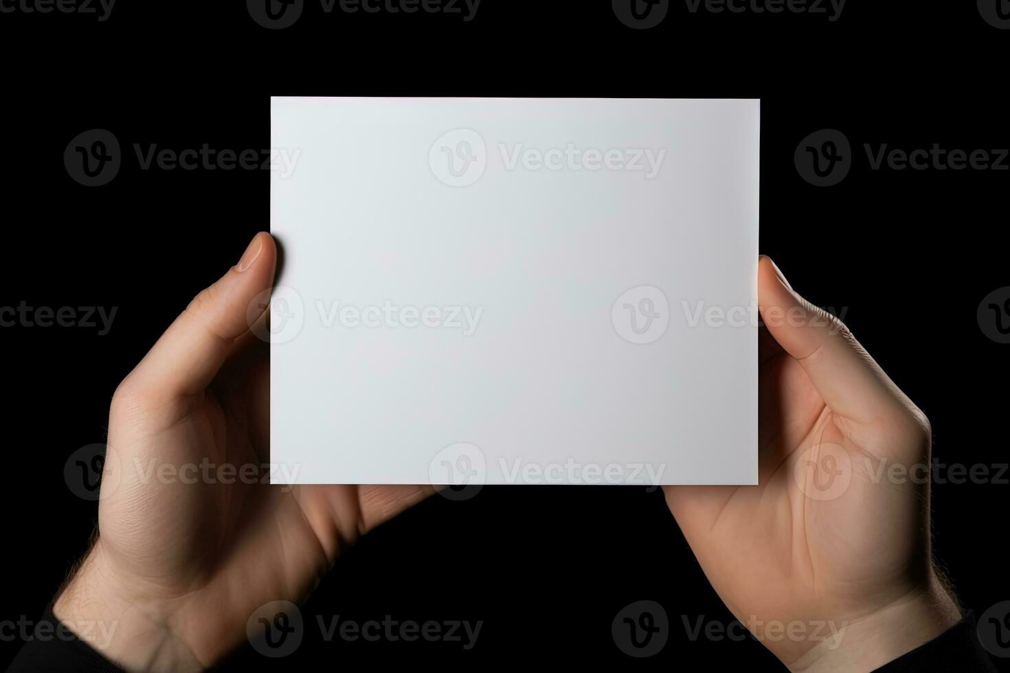 A human hand holding a blank sheet of white paper or card isolated on black background. ai generated photo