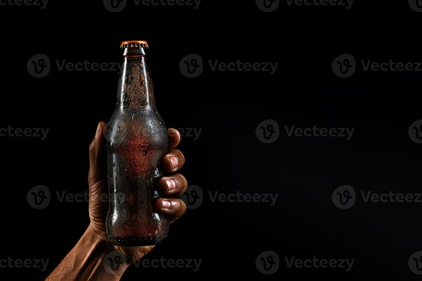 a male hand holding up a bottle of beer isolated on a black background with copy space. ai generated photo