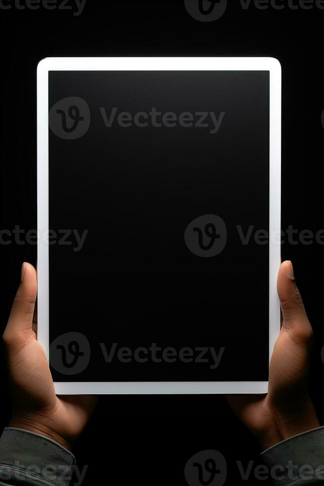 Hand holding tablet with mockup blank screen isolated on black background. ai generated photo