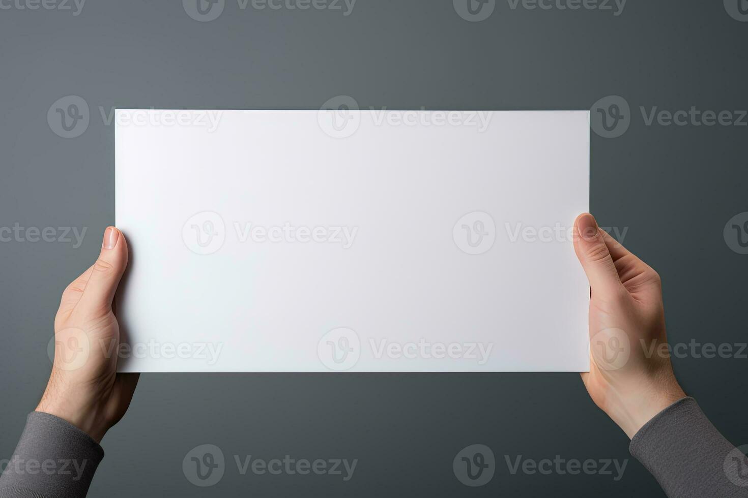 A human hand holding a blank sheet of white paper or card isolated on grey background. ai generated photo