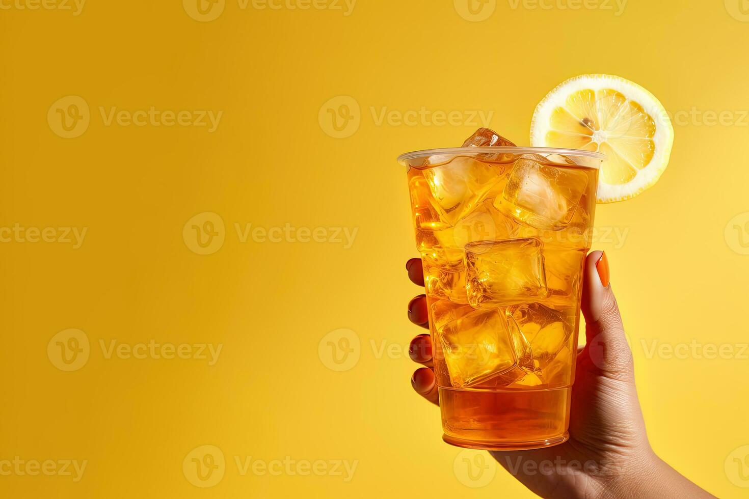 A hand holding takeaway plastic cup of delicious iced lemon tea isolated on yellow background with copy space. ai generated photo