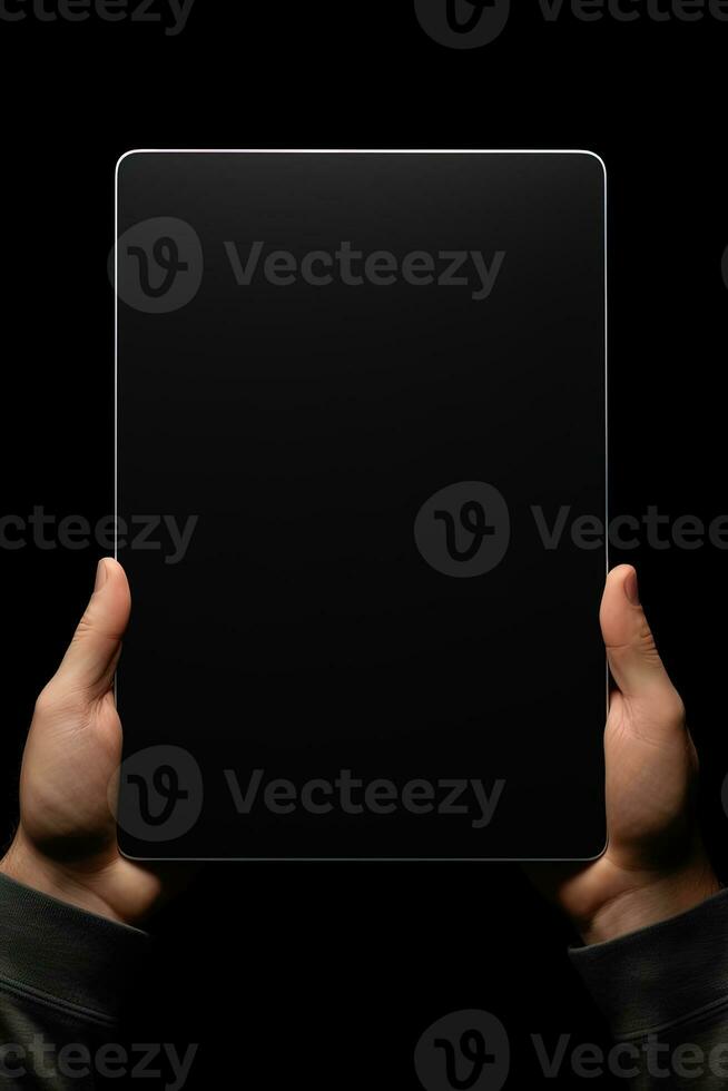 Hand holding tablet with mockup blank screen isolated on black background. ai generated photo