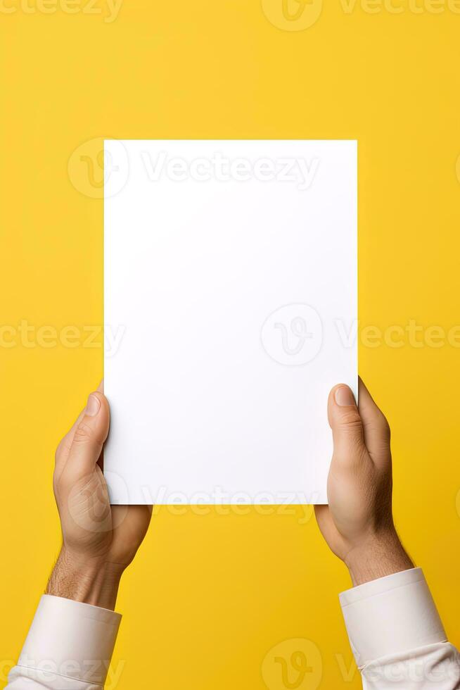 A human hand holding a blank sheet of white paper or card isolated on yellow background. ai generated photo