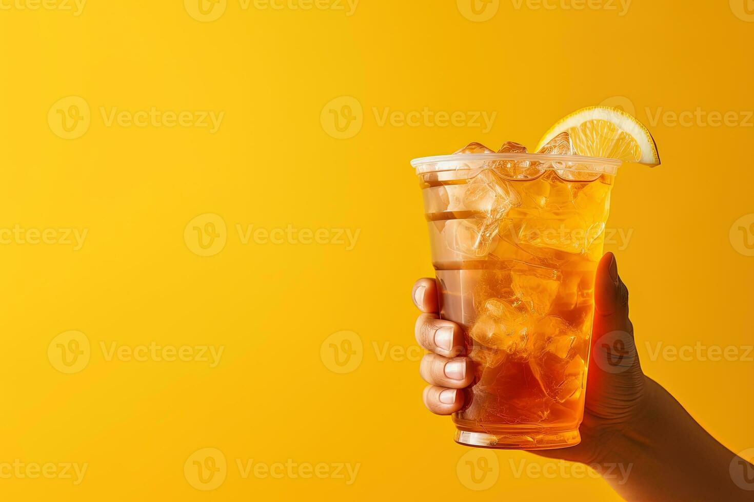 A hand holding takeaway plastic cup of delicious iced lemon tea isolated on yellow background with copy space. ai generated photo