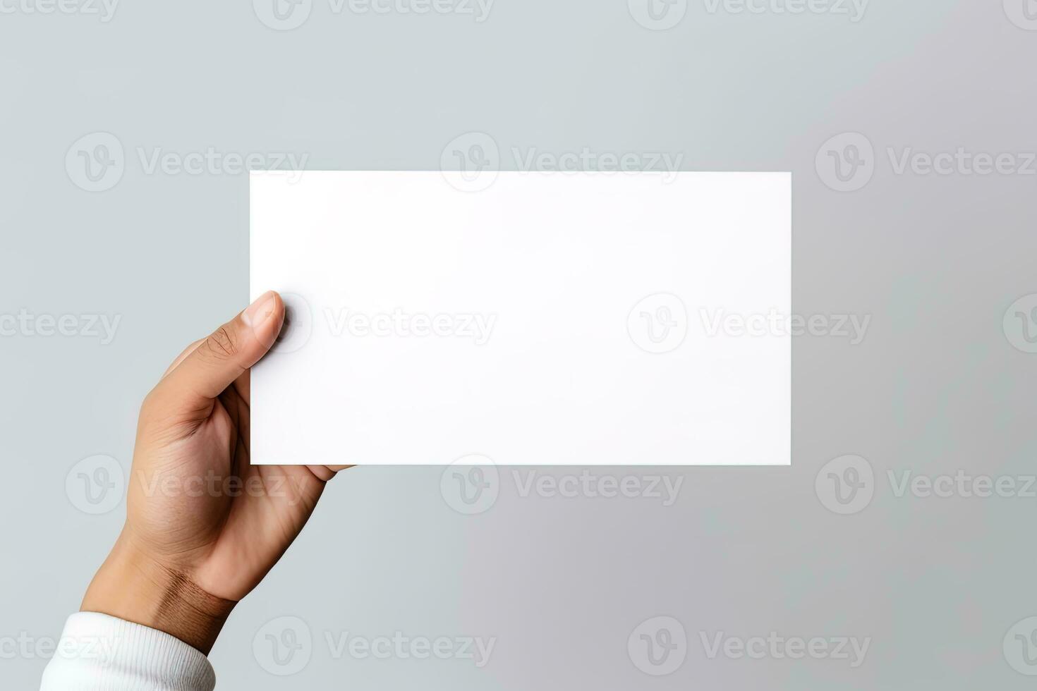 A human hand holding a blank sheet of white paper or card isolated on white background. ai generated photo