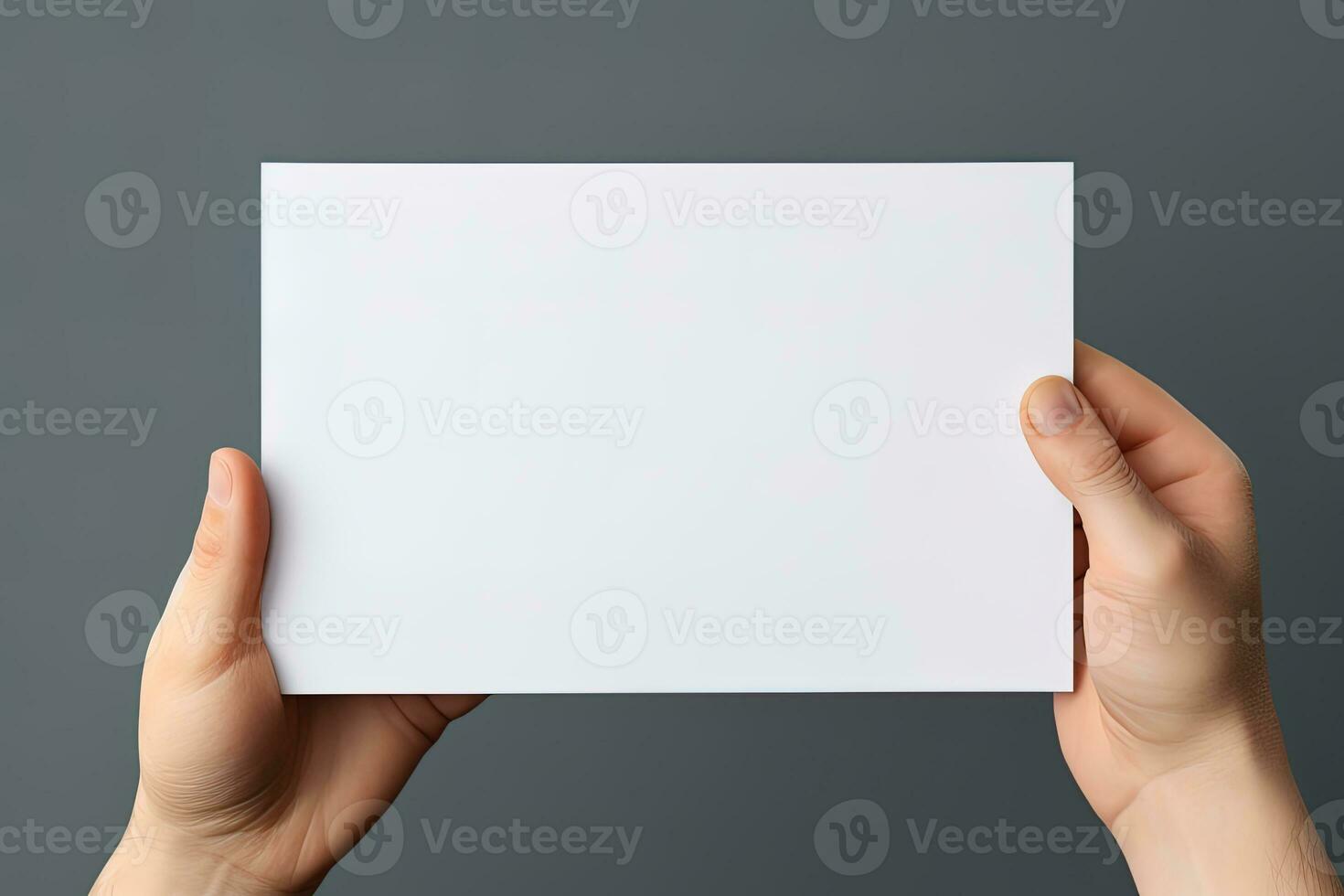 A human hand holding a blank sheet of white paper or card isolated on grey background. ai generated photo