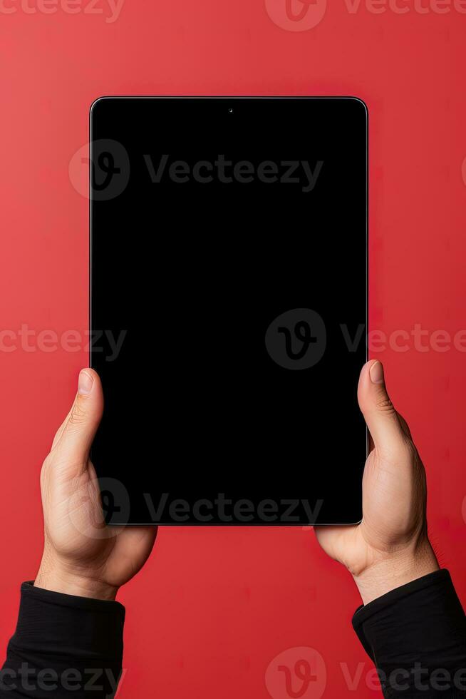 Hand holding tablet with mockup blank screen isolated on red background. ai generated photo