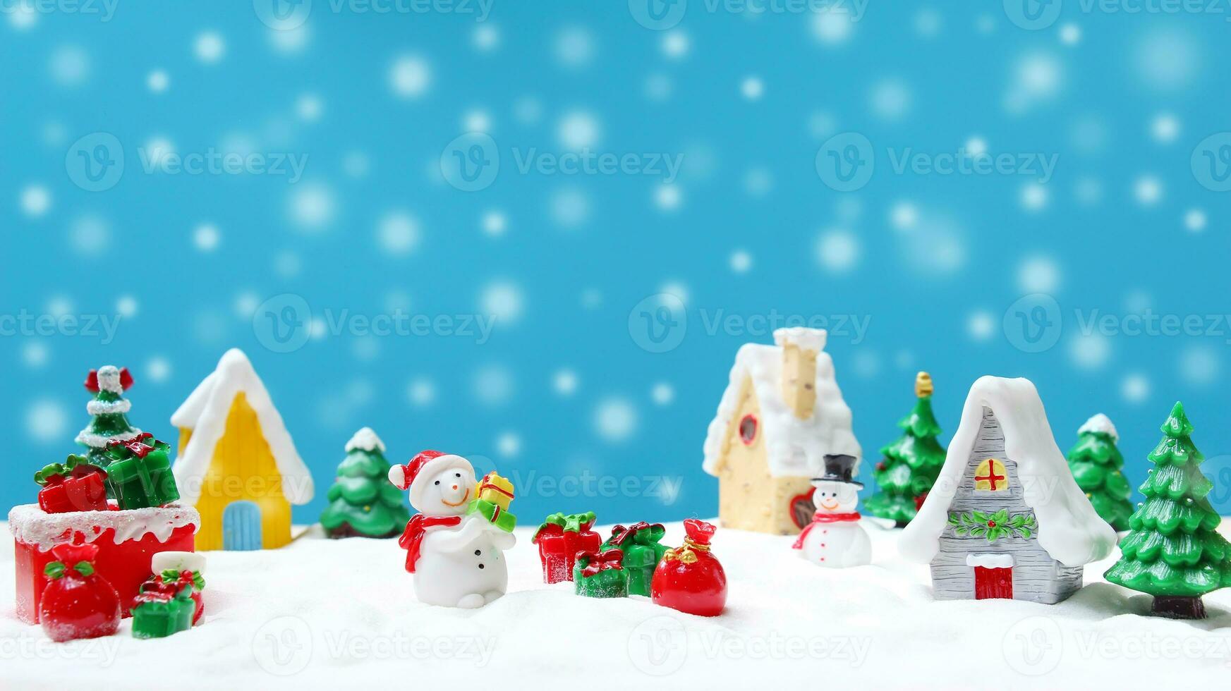 Snowman in the town with snow falling for Christmas decoration photo