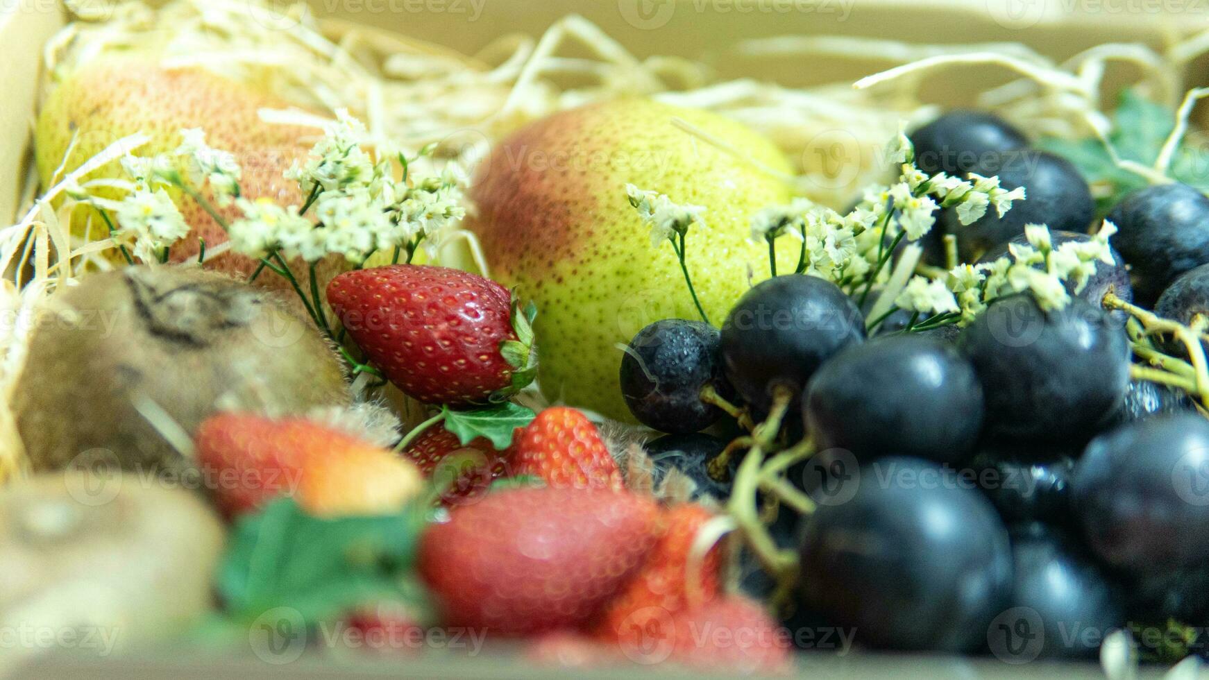 Strawberry Grapes Kiwi and Pear photo