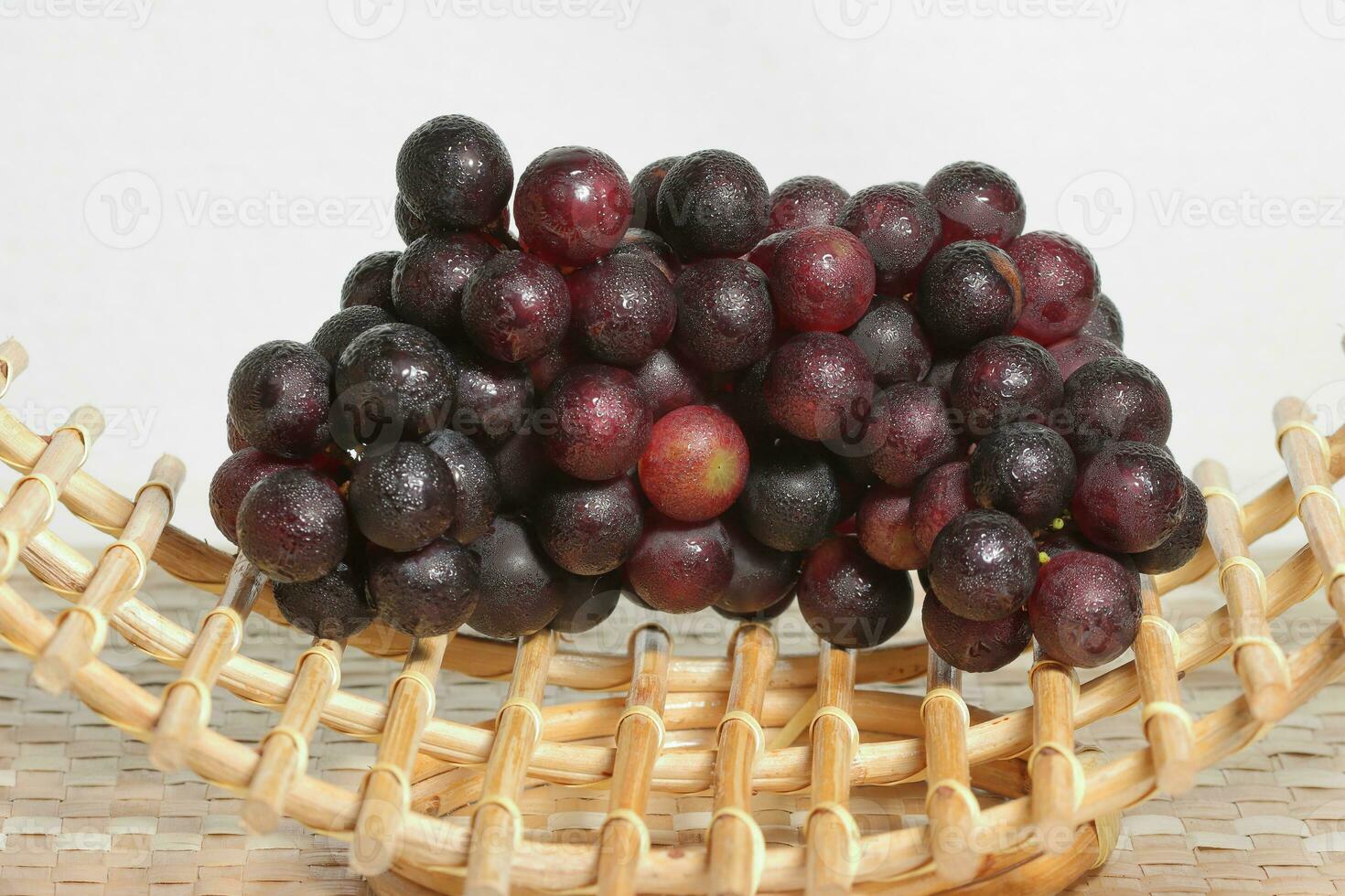 Clusters of ripe grapes on texture background photo