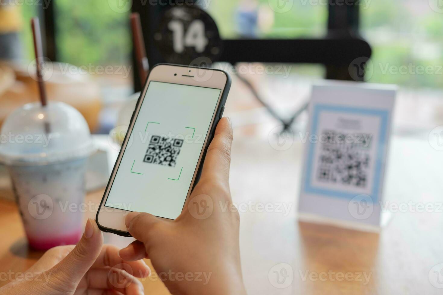 Woman use smartphone to scan QR code to pay in cafe restaurant with a digital payment without cash. Choose menu and order accumulate discount. E wallet, technology, pay online, credit card, bank app. photo