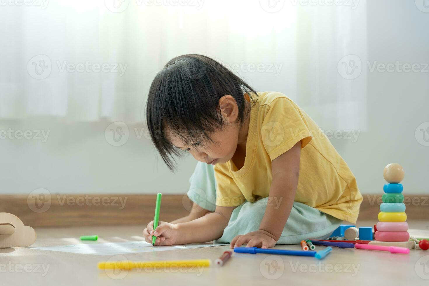 Happy Asia children playing learning paint on paper. Activity, development, IQ, EQ, meditation, brain, muscles, essential skills, family having fun spending time together. Holiday photo