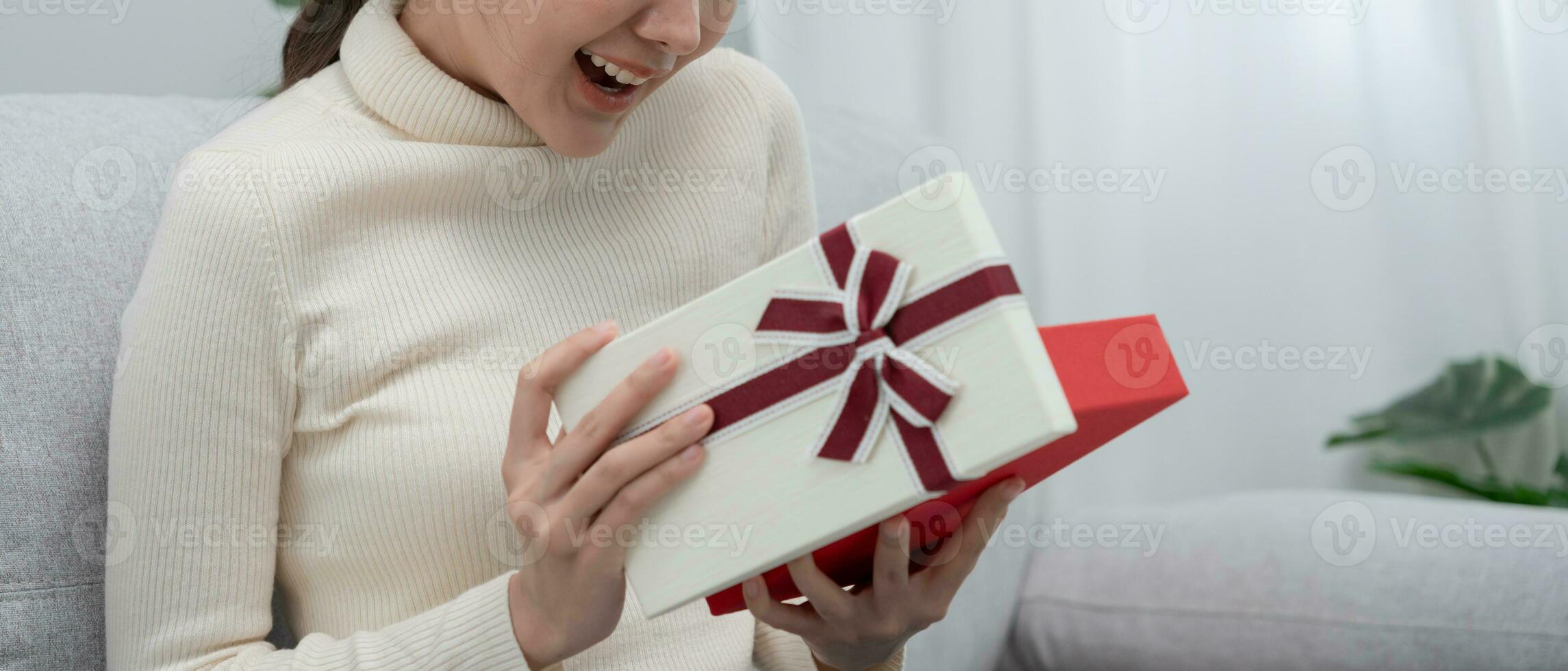 Pretty asian woman feel surprise and look interest inside presents box. cute girl excited open gift box. birthday, Celebration, xmas, New year Festival, thank, Celebrate, Valentine's Day, Anniversary photo