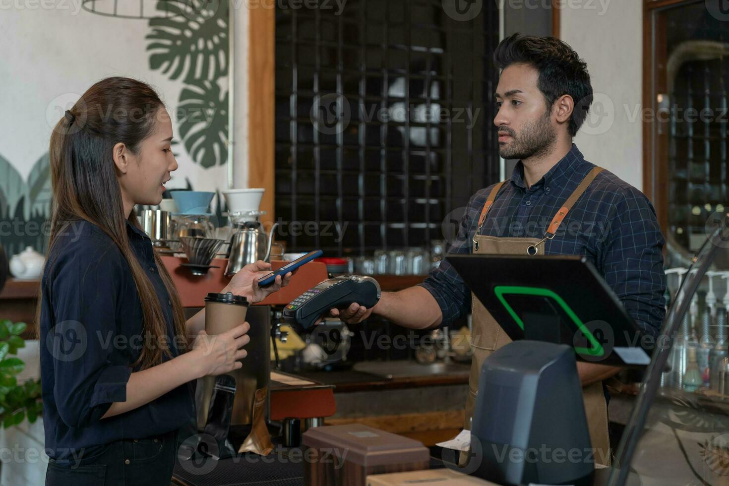 Woman use smartphone to scan QR code to pay in cafe restaurant with a digital payment without cash. Choose menu and order accumulate discount. E wallet, technology, pay online, credit card, bank app. photo