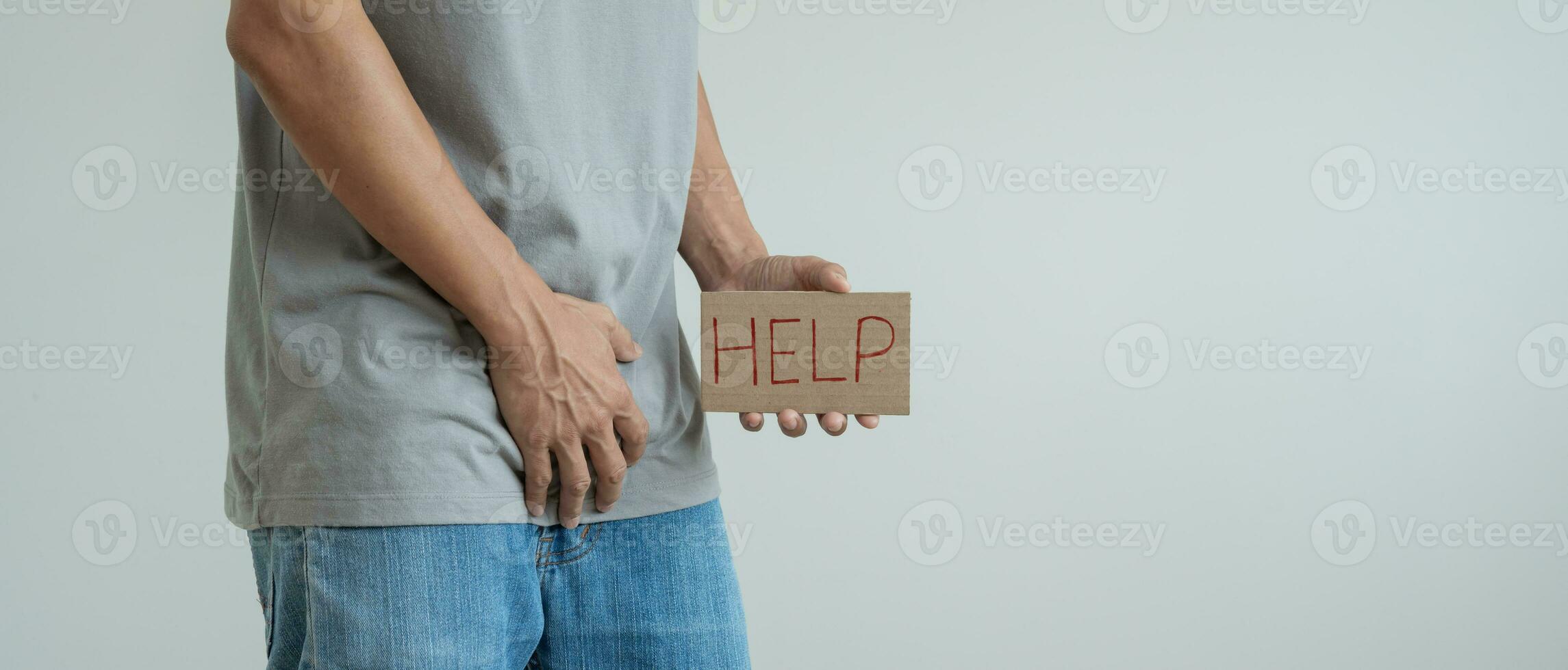 Man hold hand in front of private parts feeling discomfort from disease and inflammation. Venereal, testicular cancer. bladder problems, erectile dysfunction, premature ejaculation, prostate cancer photo