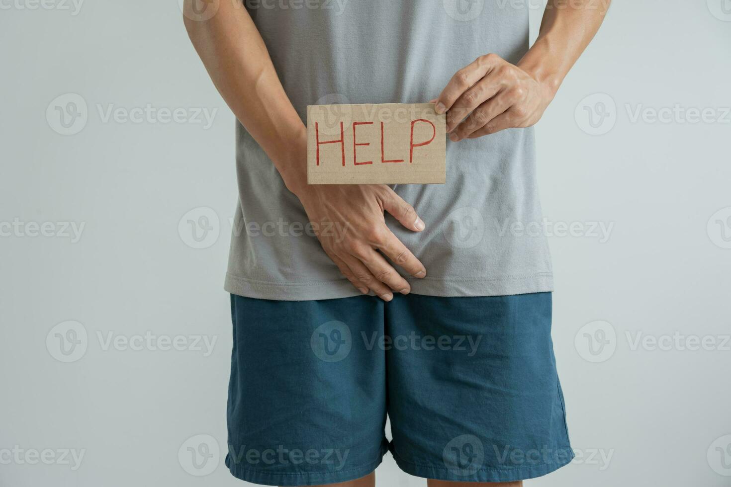Man hold hand in front of private parts feeling discomfort from disease and inflammation. Venereal, testicular cancer. bladder problems, erectile dysfunction, premature ejaculation, prostate cancer photo