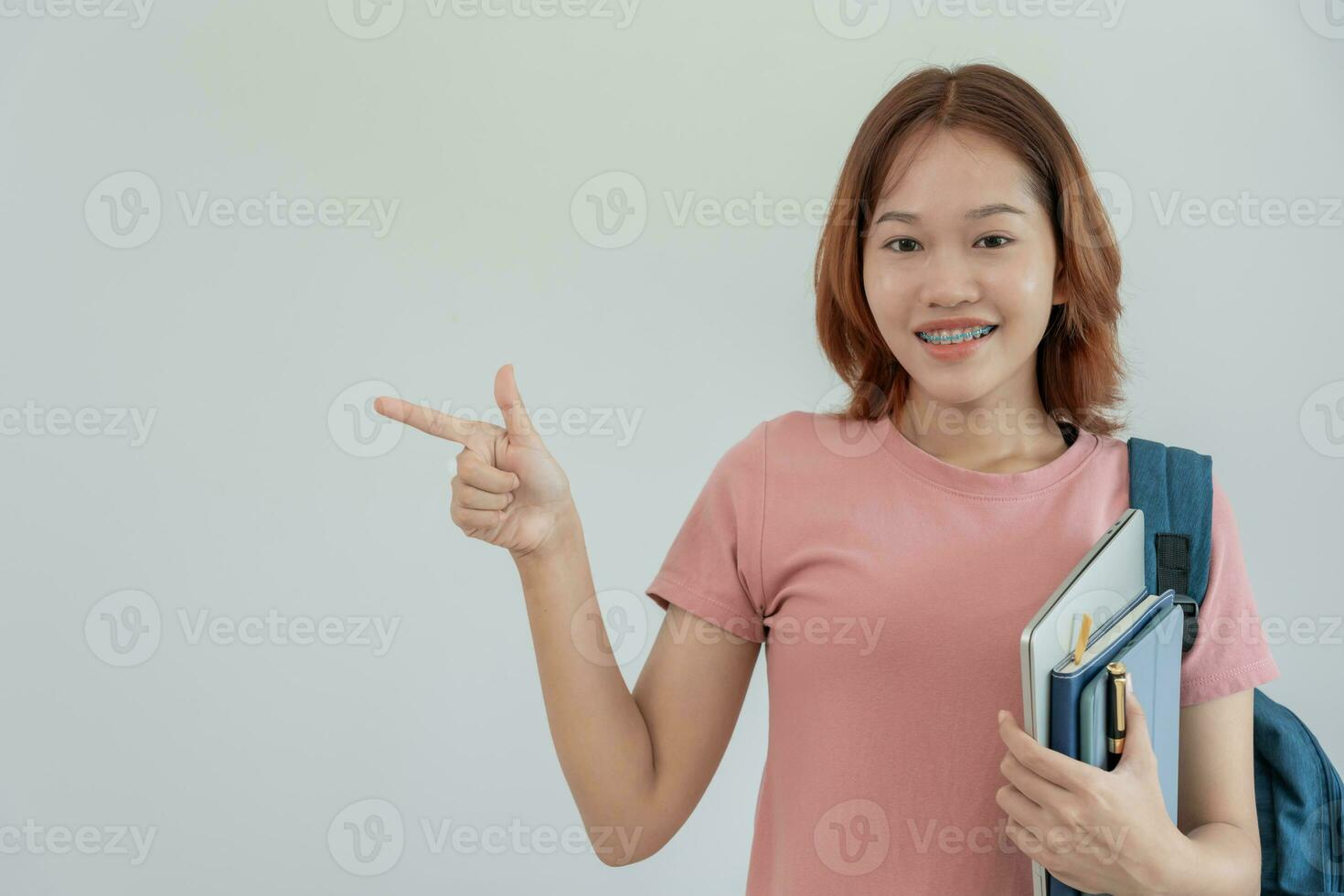 Portrait beautiful Asian woman student. Smile girl happy study. read book in college campus. young female on international Asia University. Education, study, school, learning, exam, continue education photo