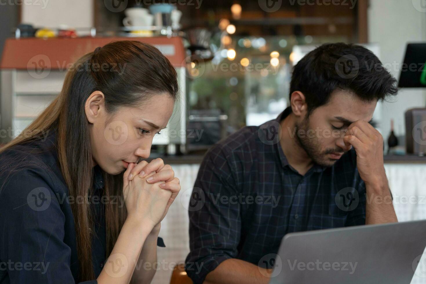 Stressed and headache asian couple with large bills or invoices no money to pay to expenses and business problem. shortage, Financial problems, mortgage, loan, bankruptcy, bankrupt, poor photo