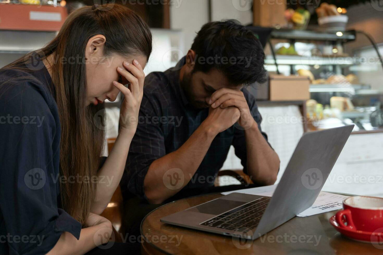 Stressed and headache asian couple with large bills or invoices no money to pay to expenses and business problem. shortage, Financial problems, mortgage, loan, bankruptcy, bankrupt, poor photo