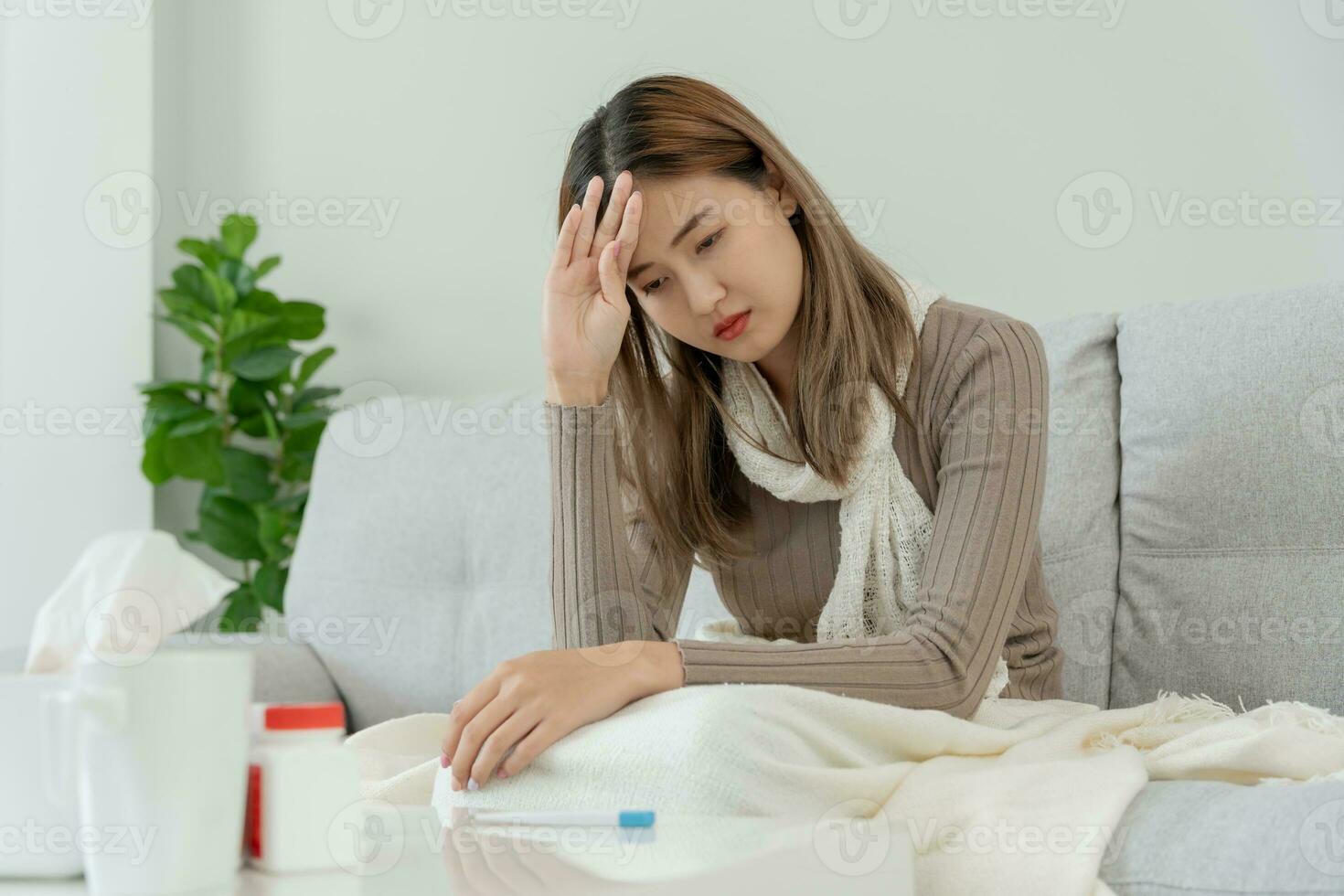 sick woman with a headache and feeling cold on sofa, female sneezing and runny nose with seasonal influenza, allergic, high fever and influenza, resting, virus, coronavirus, feel illness, respiratory photo