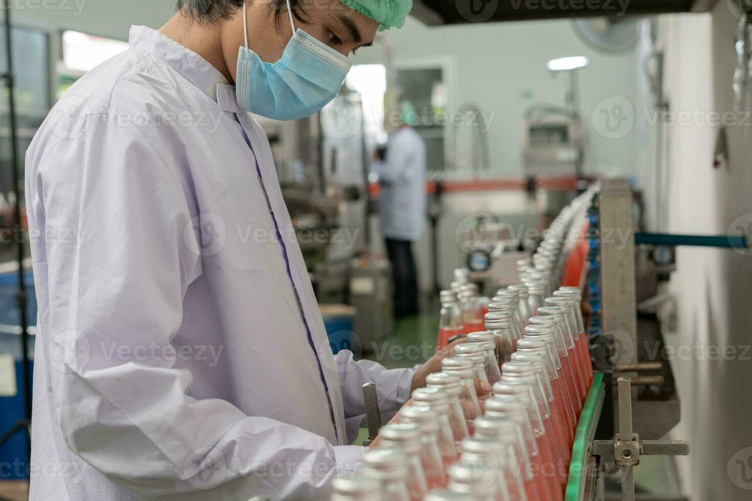 quality inspector food or beverages technician inspection about quality control food or beverages before send product to the customer. Production leader recheck ingredient and productivity. photo
