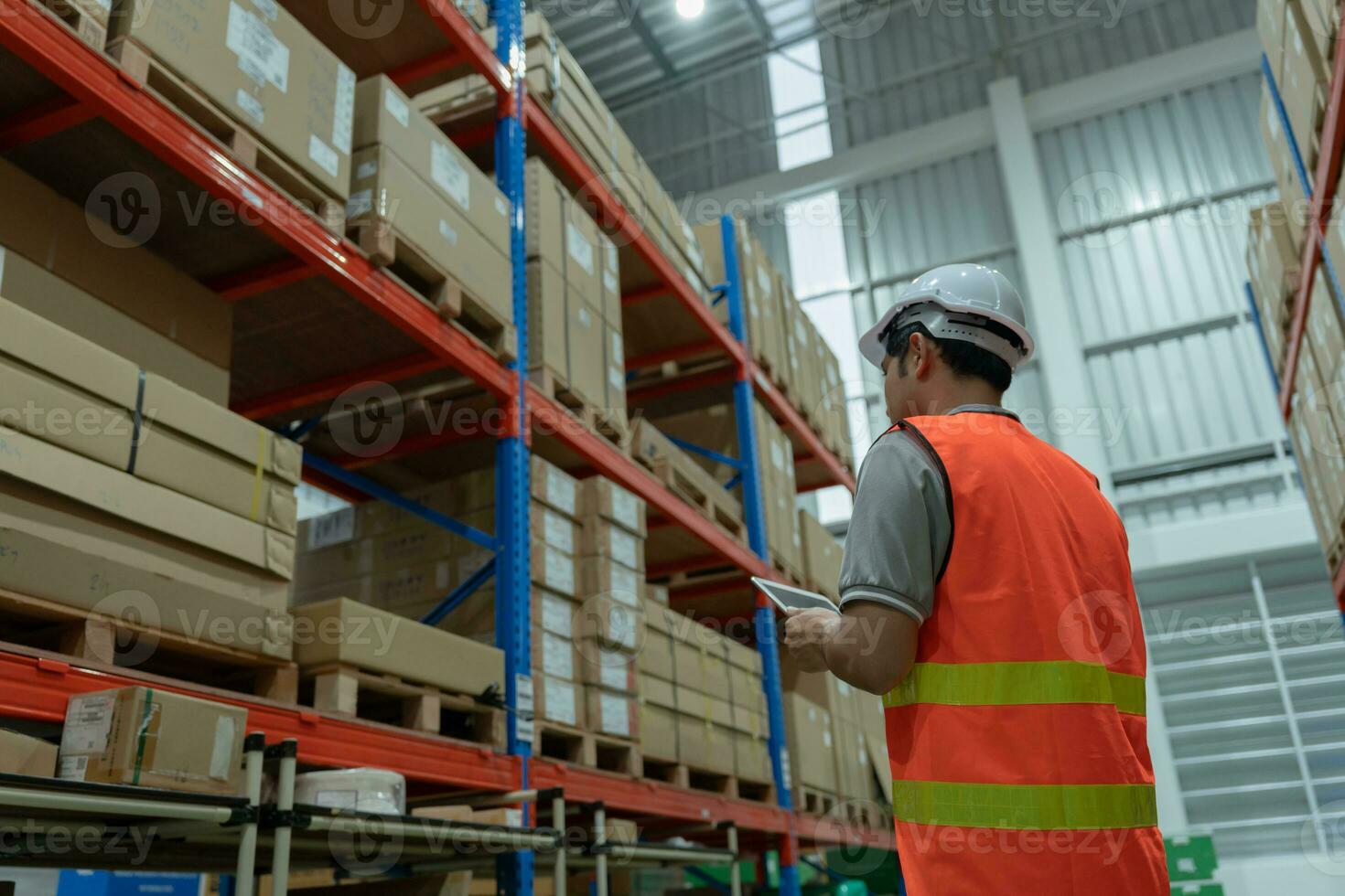 Asian male factory inspect and check inventory on warehouse, count stock product. Transport logistic business shipping, delivery to customers. inspection, storehouse, storage, factory, manage. photo