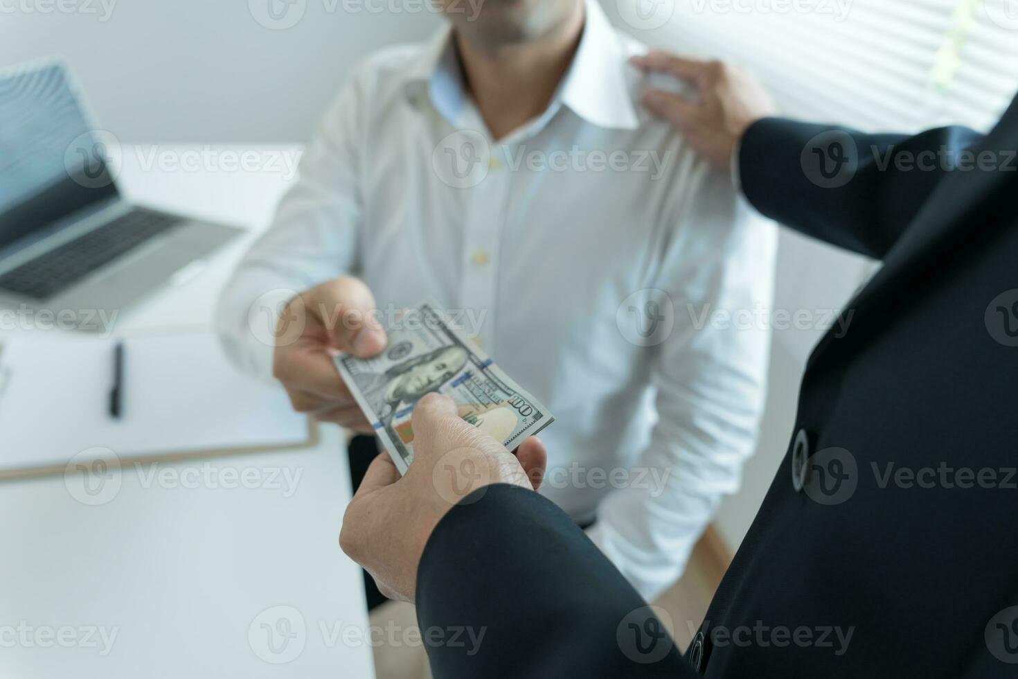 Businessmen receive salary or bonuses from management or Boss. Company give rewards to encourage work. Smiling businessman enjoying a reward at the desk in the office. photo