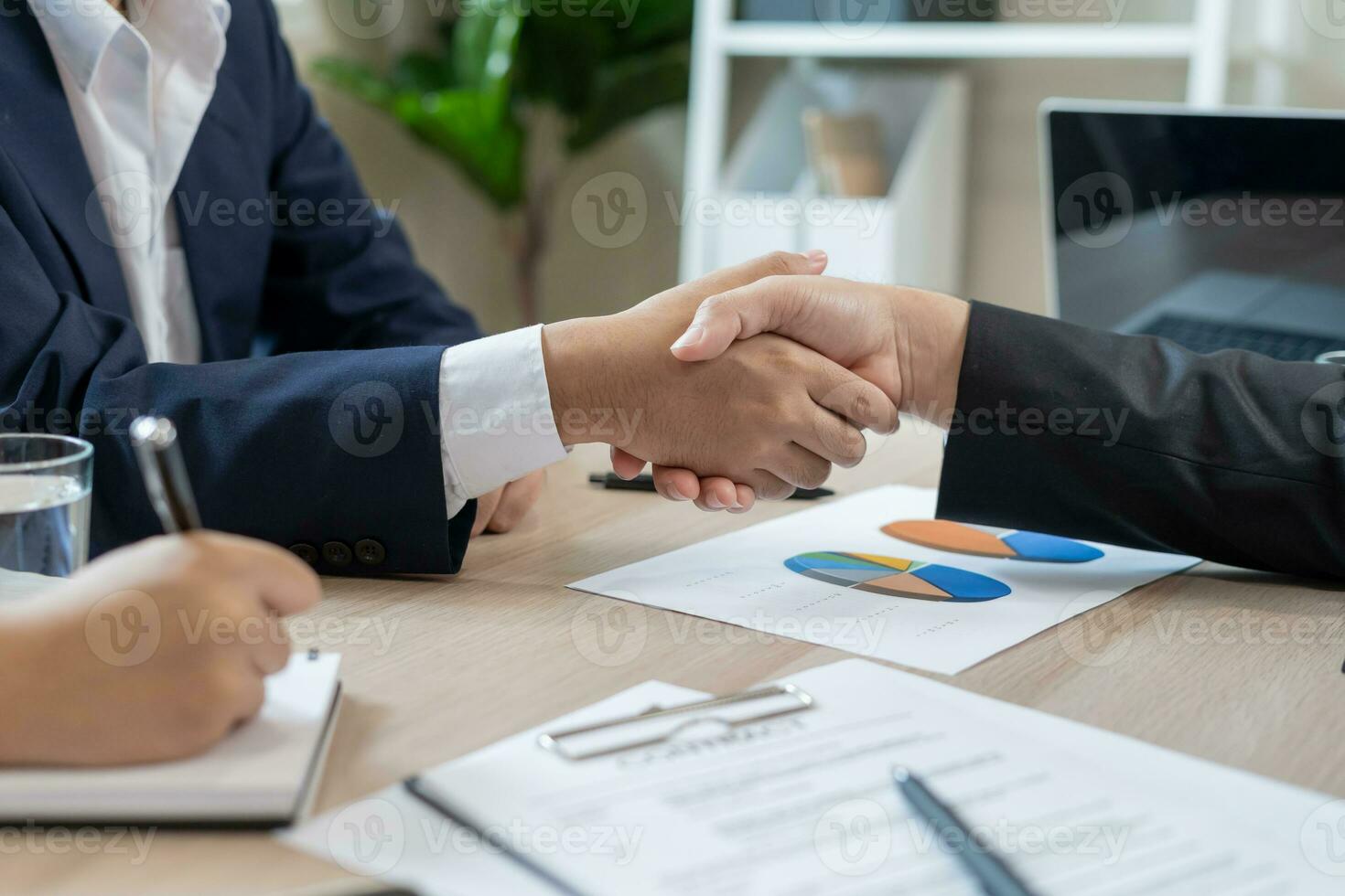 Executives are shaking hand after results success to target. financial data analysis and market growth report chart. Planning Strategies, startup project, profitable strategy, Business meeting time photo