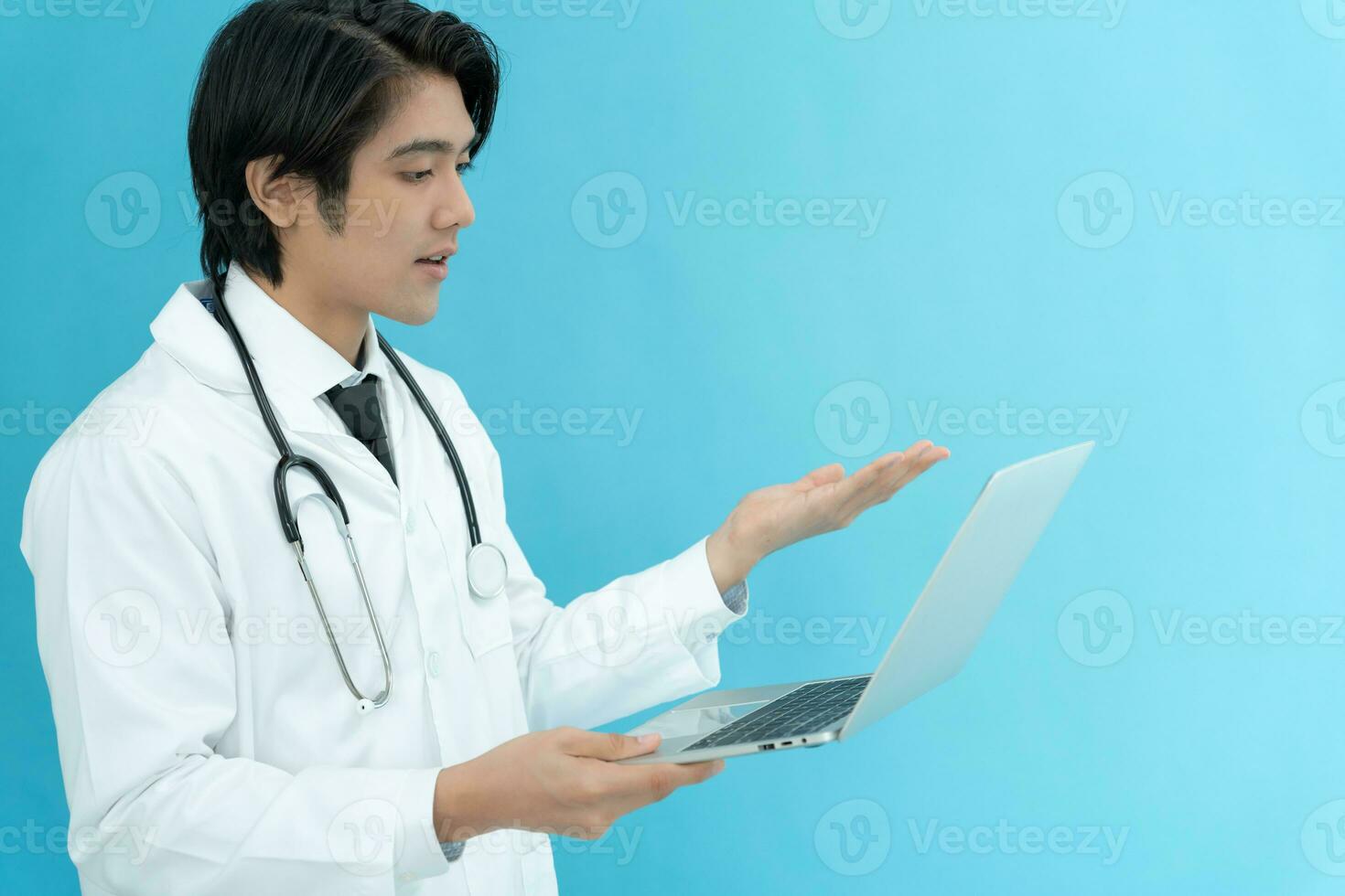 telemedical. Doctors are advising patients over the Internet by video conference. Asian doctor is treating patients through telecommunication while describing the disease . Technology for health. photo