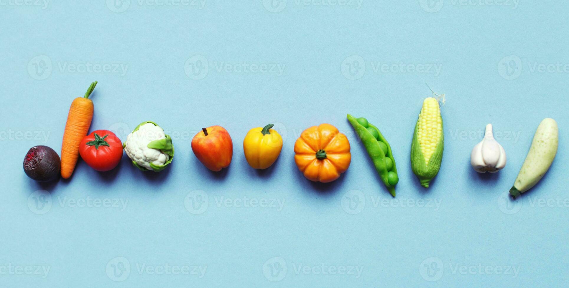 many vegetables and fruits on blue turquoise background. healthy food concept photo