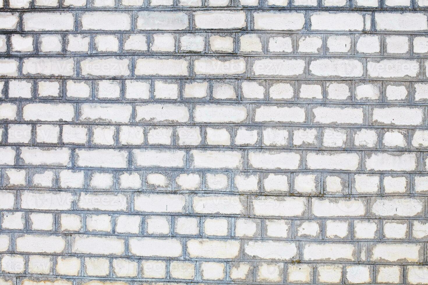 Old brick white color wall background. Light stone texture photo