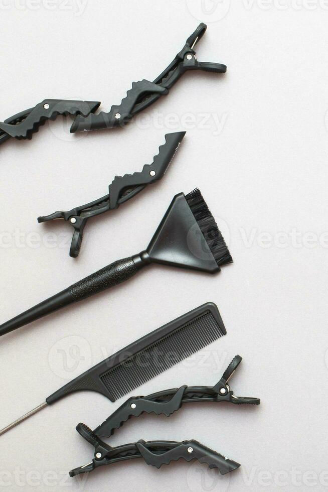 various hairdressing tools on a gray background. beauty salon concept photo