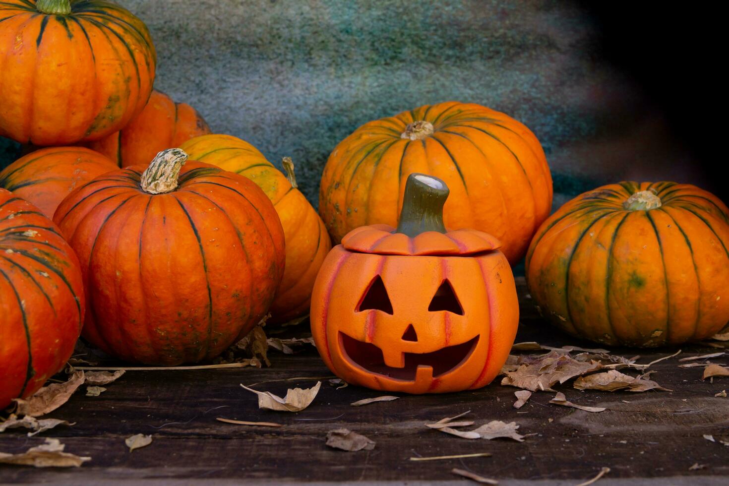 Jack-o'-lantern with pumpkins, halloween decoration photo