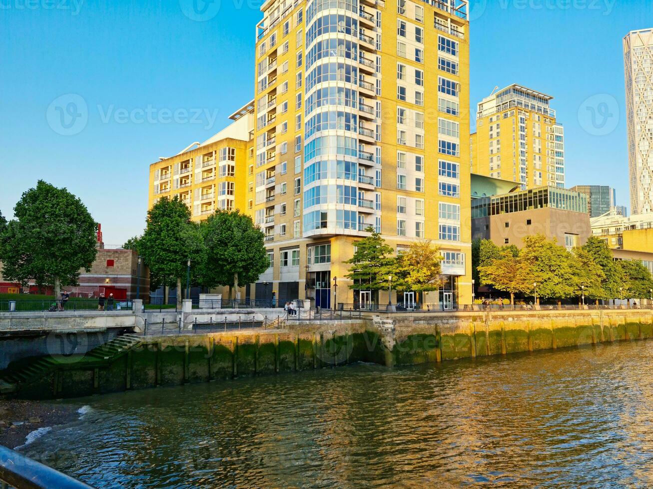 Low Angle View of Canary Wharf Buildings at Central London City of England Great Britain. The Footage Was Captured on June 8th, 2023 During Clear Sunny Day. High Resolution 64 Mega Pixels Image photo