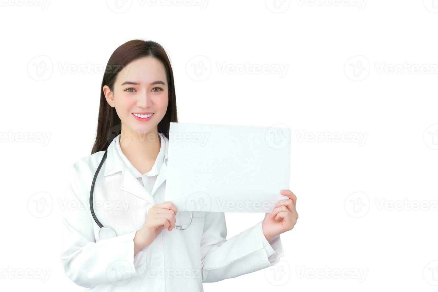 Professional young Asian woman doctor who wears medical coat holds and shows white paper to present something in healthcare concept with isolated on white background. photo