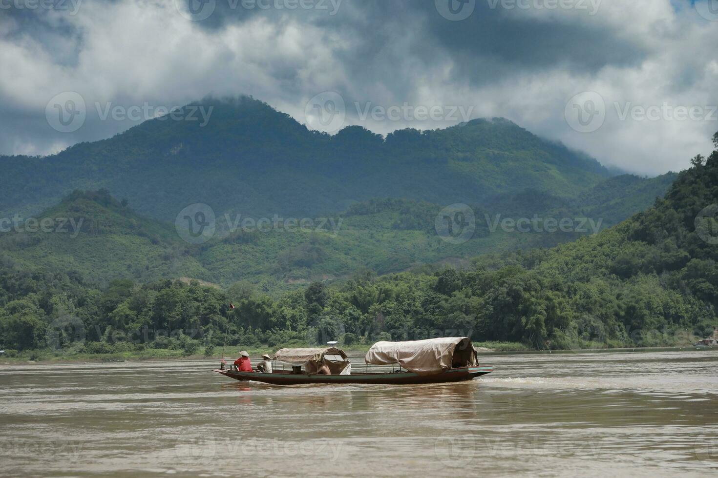 domestic boat sailing in maekong river luang prabang northern of laos photo