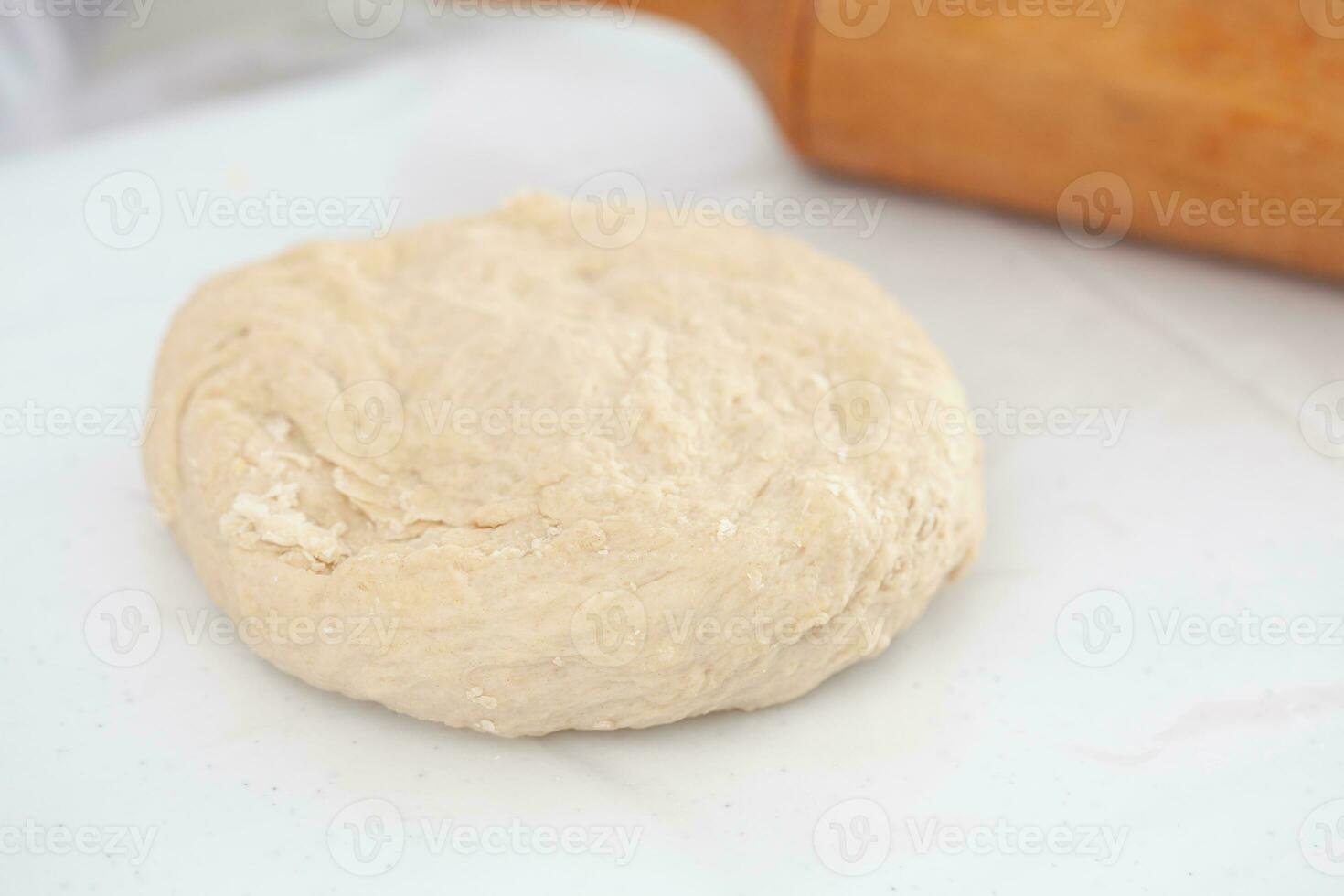 Pizza dough ball ready to stretch. Pizza dough ingredients. Pizza preparation. photo