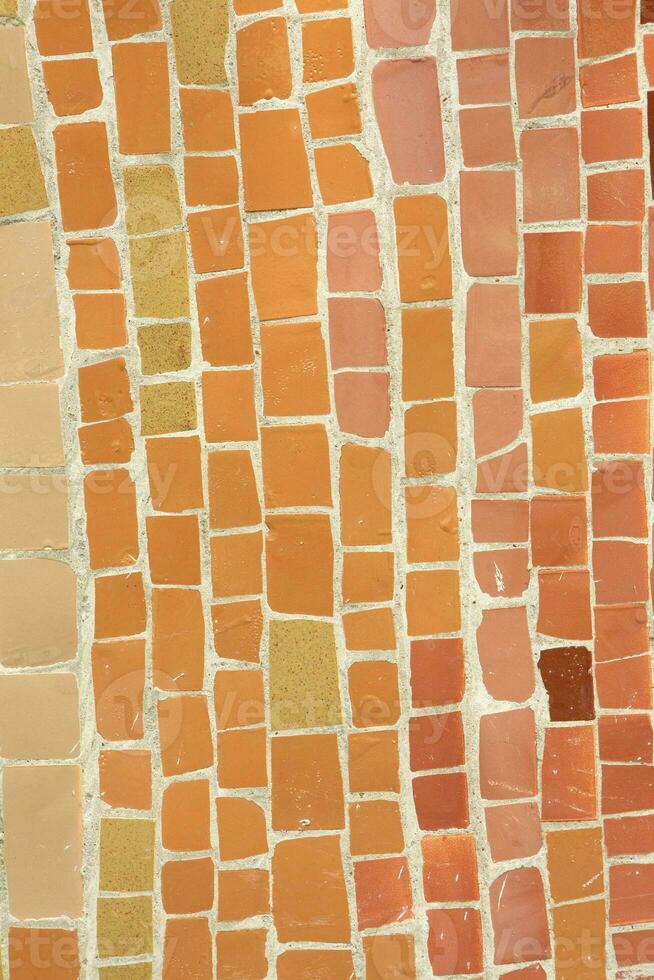 Colorful ceramic mosaic on the walls of the building. Abstract background and texture for design. photo
