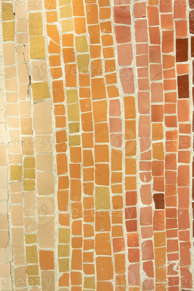 Colorful ceramic mosaic on the walls of the building. Abstract background and texture for design. photo