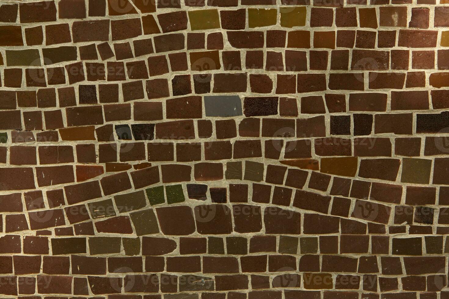 Colorful ceramic mosaic on the walls of the building. Abstract background and texture for design. photo