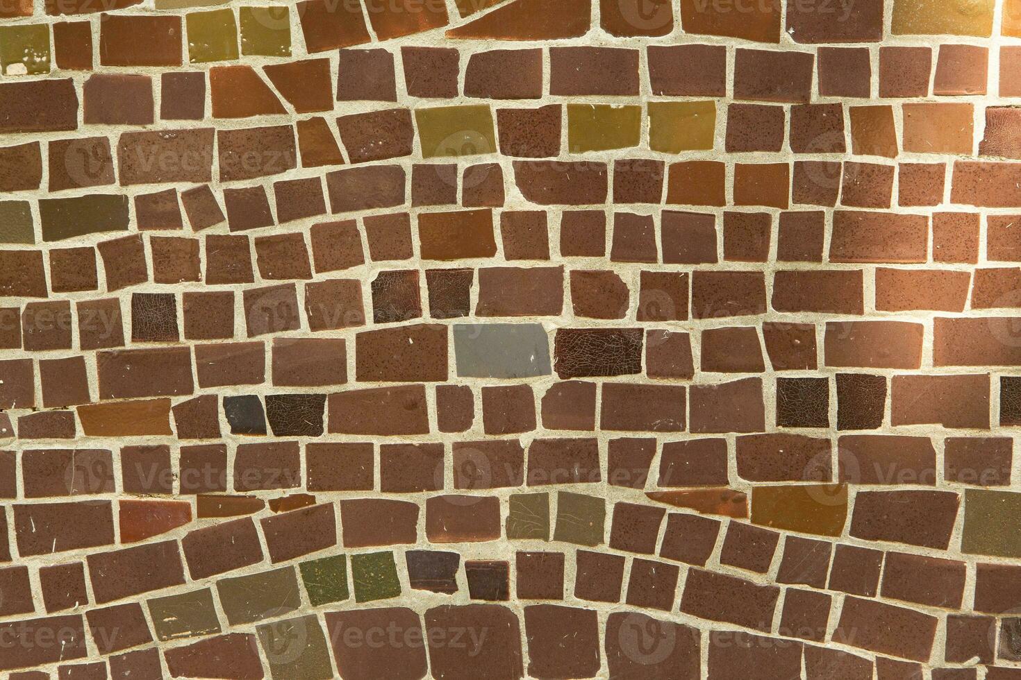 Colorful ceramic mosaic on the walls of the building. Abstract background and texture for design. photo