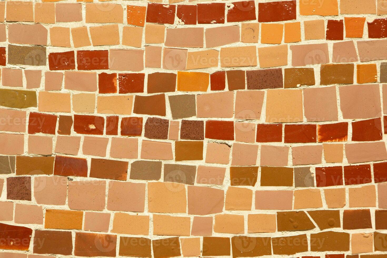 Colorful ceramic mosaic on the walls of the building. Abstract background and texture for design. photo