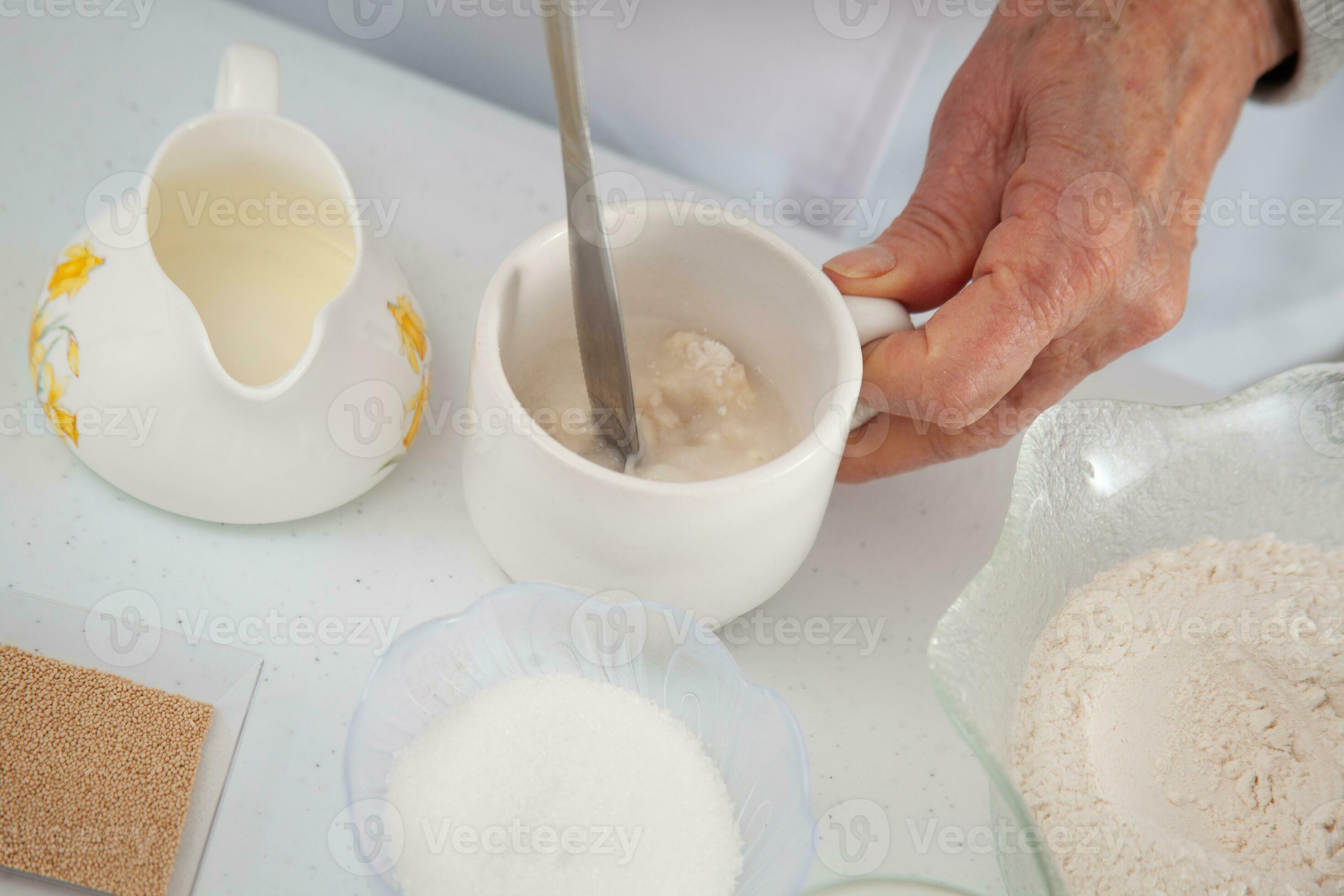 Leaven yeast. Yeast preparation for pizza dough. Mixing water, flour