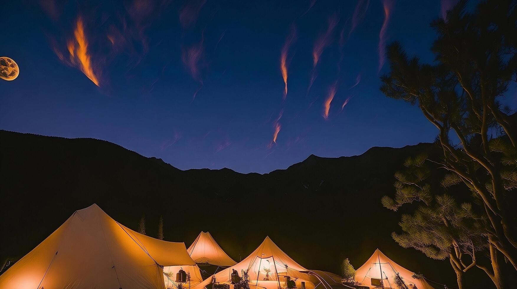 Camping in the mountains at sunset. photo