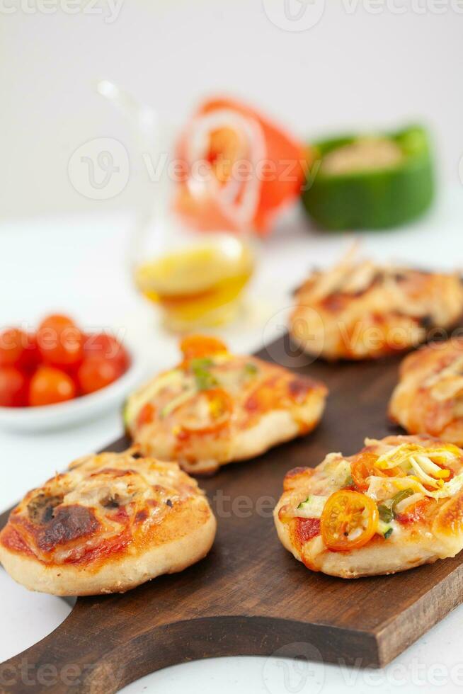 Delicious just baked homemade mini pizzas. photo