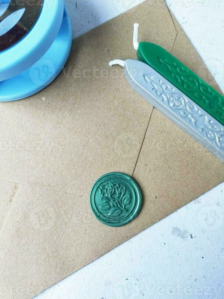 Old letter with wax seal and wax seal on old map background. photo