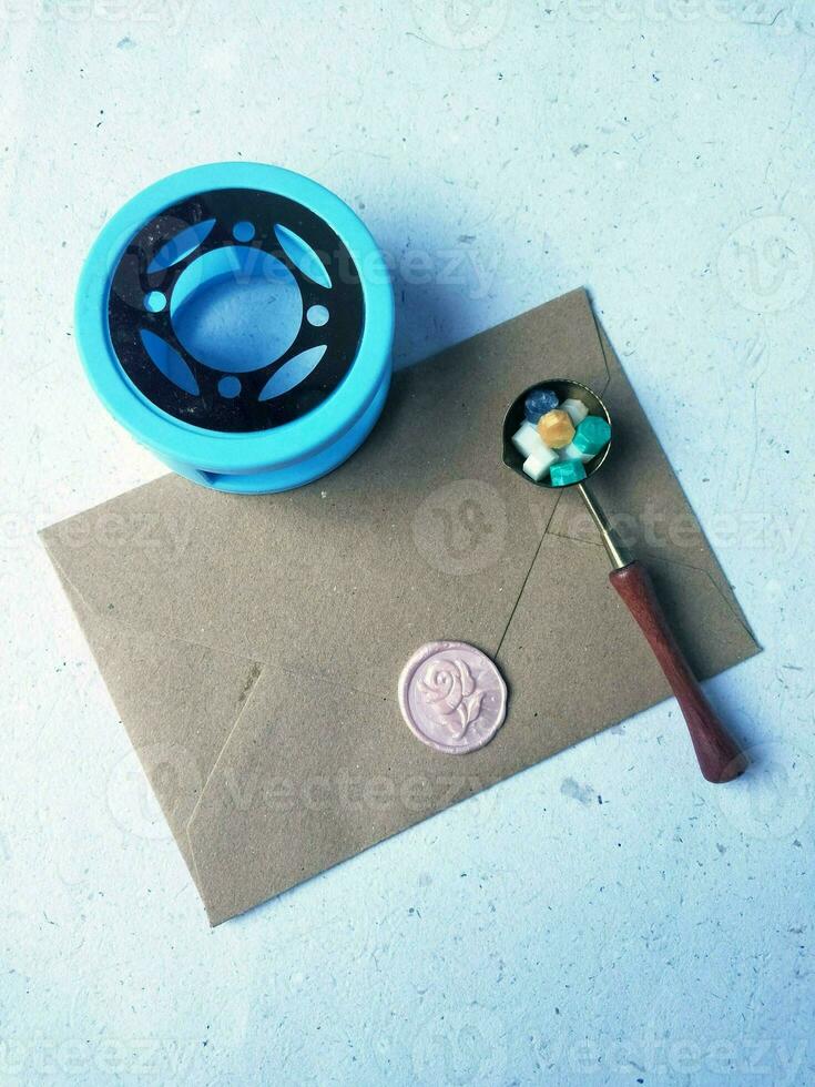 Old letter with wax seal and wax seal on old map background. photo